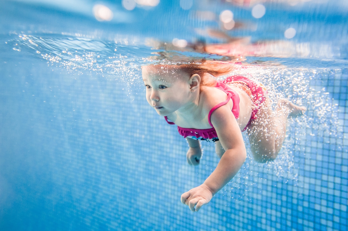 little-baby-girl-swimming-under-water-in-paddling-2025-01-09-03-01-06-utc
