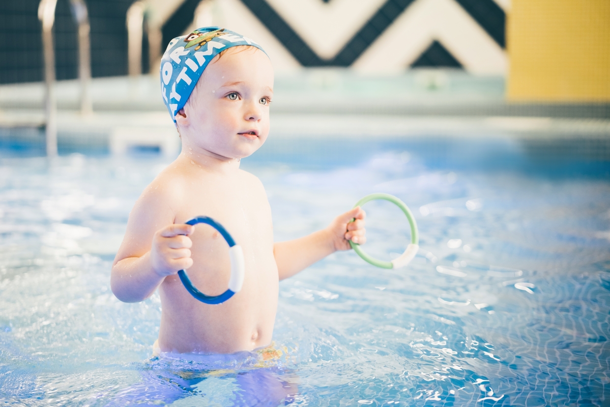 little-boy-playing-in-blue-water-of-swimming-pool-2025-01-09-07-17-12-utc